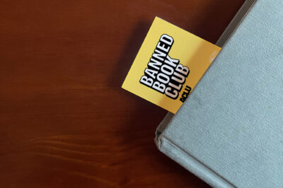 An ϰſ bookmark sticking out of a book.